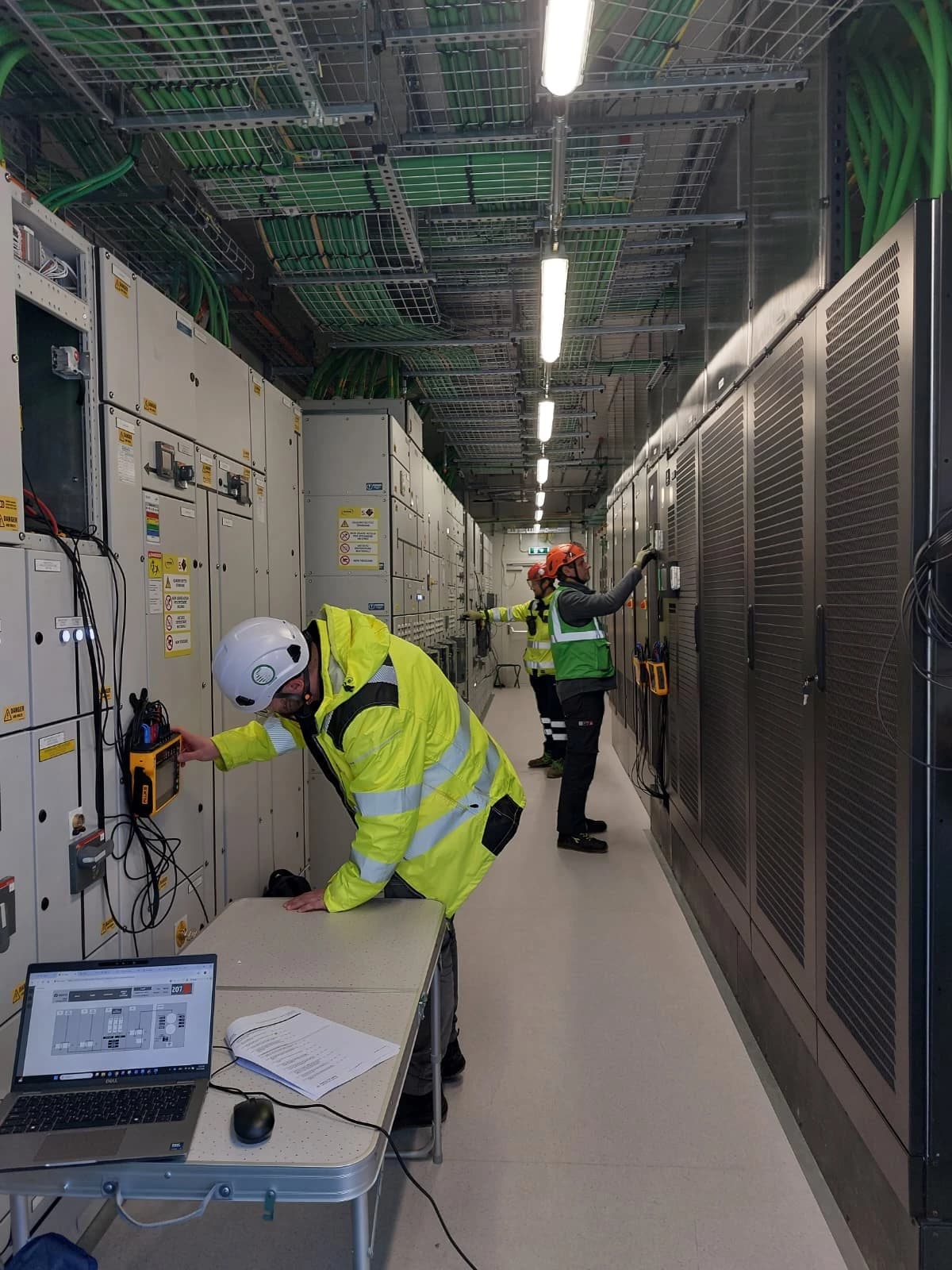 RN commissioning engineers testing switchgear and UPS systems during integrated systems testing