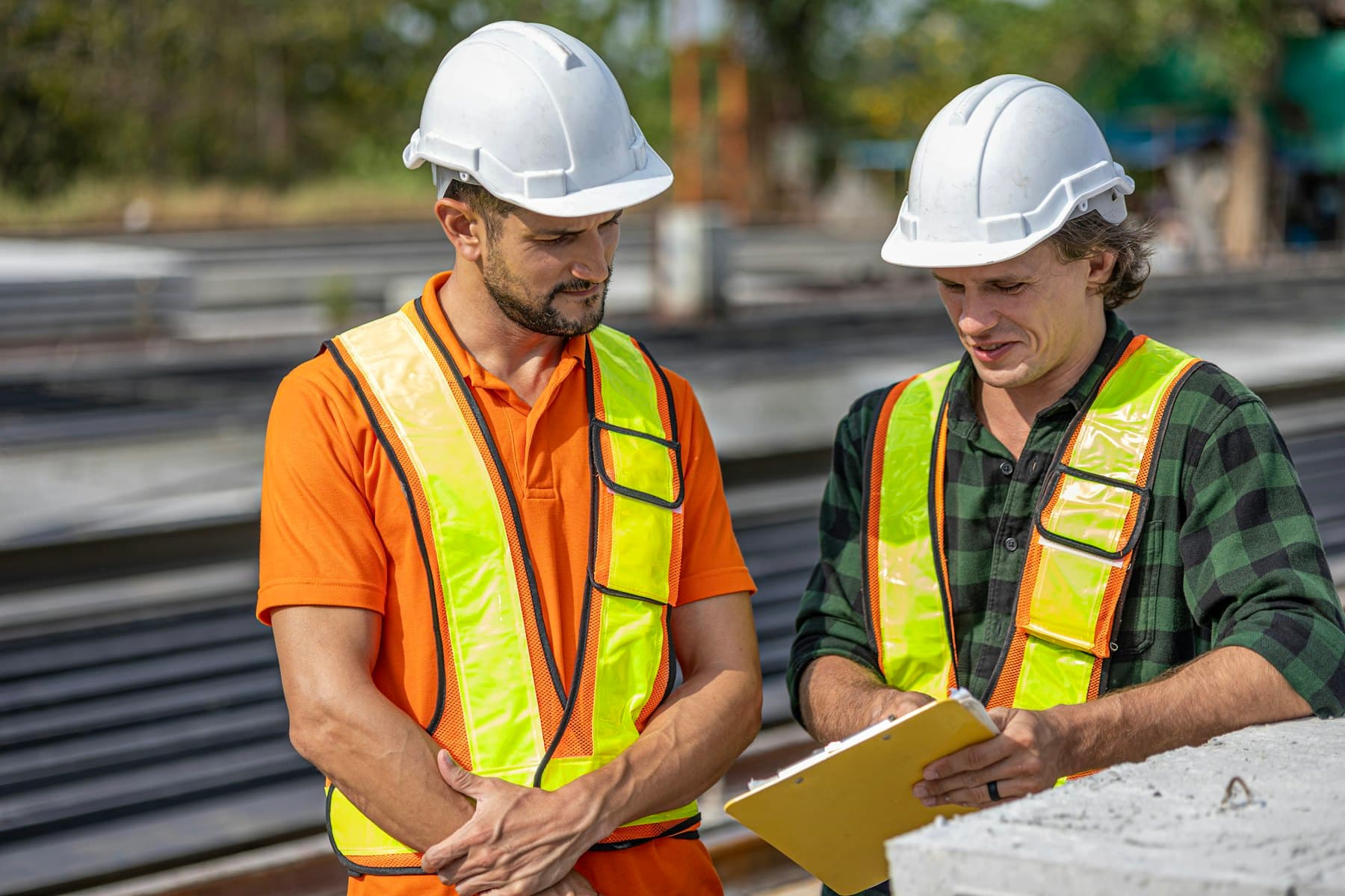 Engineers reviewing project documentation on site